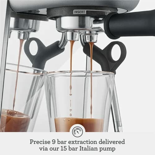 Espresso machine extracting coffee into a glass cup.