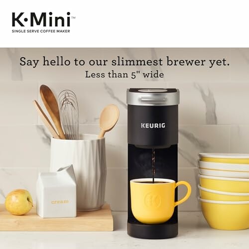 Keurig K-Mini coffee maker with yellow mug and kitchen items